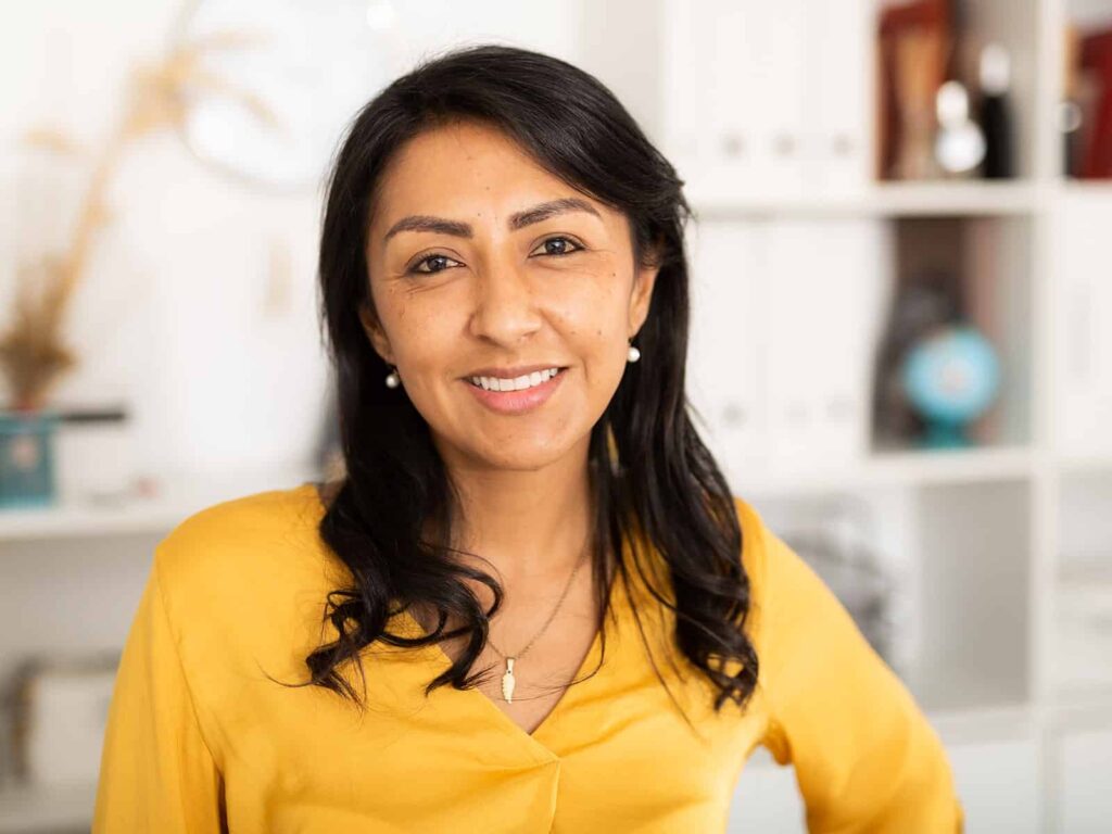 Woman smiling in living room min