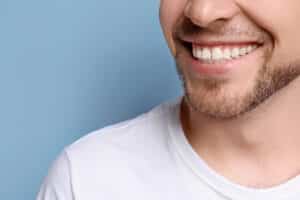 A man with All-on-X implants smiling