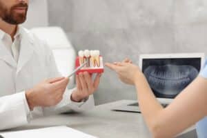 Doctor having a consultation about restorative dentistry options with a patient